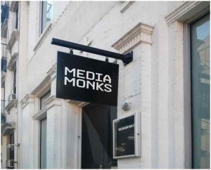 media monks swinging sign