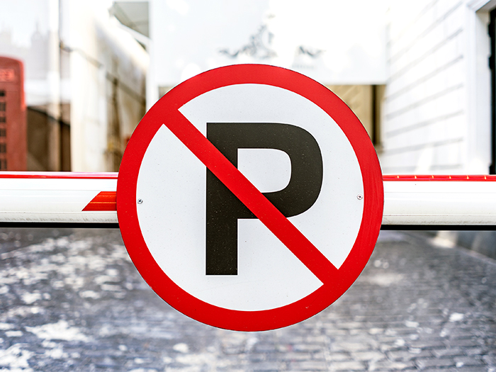 no auto parking sign bolted barrier city